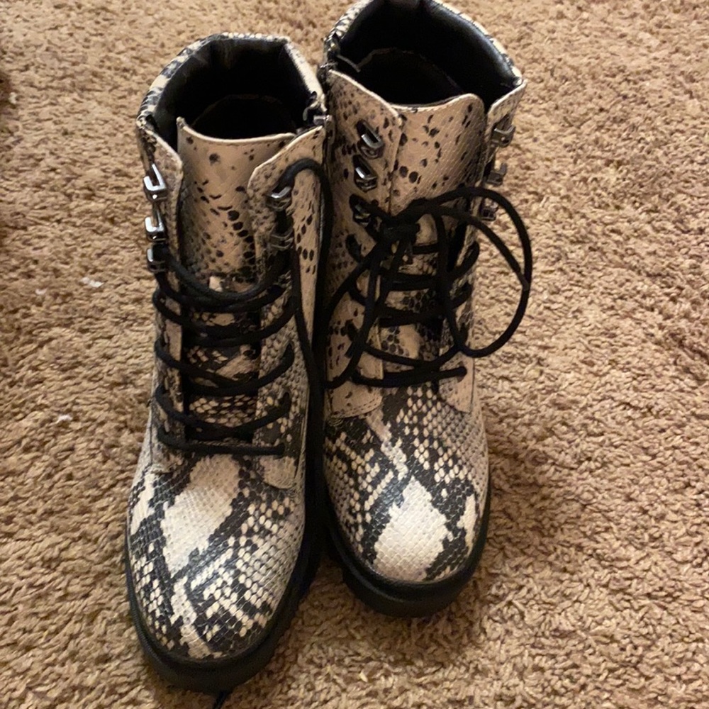 Snakeprint combat boots.